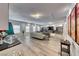 Well-lit basement with hardwood floors, modern decor, and plenty of space at 5438 Sierra Brook Ct, Las Vegas, NV 89149
