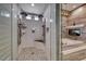 Luxurious bathroom showcasing a large walk-in shower with dual shower heads, a soaking tub and fireplace at 5438 Sierra Brook Ct, Las Vegas, NV 89149