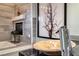 Modern bathroom with a unique basin sink, beautiful artwork, a fireplace, and elegant finishes at 5438 Sierra Brook Ct, Las Vegas, NV 89149
