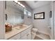 Cozy powder room featuring a vanity, a toilet, and modern lighting at 5438 Sierra Brook Ct, Las Vegas, NV 89149