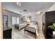 This stylish bedroom has two twin beds, modern furnishings, and bright natural light at 5438 Sierra Brook Ct, Las Vegas, NV 89149