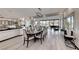 Elegant dining room with hardwood floors, designer lighting, and an open concept design at 5438 Sierra Brook Ct, Las Vegas, NV 89149