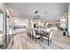 Spacious dining area with a large table, modern lighting, and open layout connecting to the kitchen and living spaces at 5438 Sierra Brook Ct, Las Vegas, NV 89149