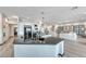 Modern kitchen with white cabinetry, black appliances, and views of the open-concept layout at 5438 Sierra Brook Ct, Las Vegas, NV 89149