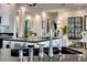 Modern kitchen featuring stainless steel fixtures, black countertops, and an open layout perfect for entertaining at 5438 Sierra Brook Ct, Las Vegas, NV 89149