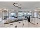 Bright, modern kitchen features a large island, sleek countertops, and stainless steel appliances at 5438 Sierra Brook Ct, Las Vegas, NV 89149