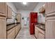 Spacious laundry room with updated appliances, plenty of storage, and a granite countertop at 5438 Sierra Brook Ct, Las Vegas, NV 89149