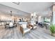 Expansive living room with hardwood floors, an open concept design, and plenty of space for entertaining at 5438 Sierra Brook Ct, Las Vegas, NV 89149