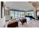 Elegant living room with hardwood floors, bright lighting, and views of the pool at 5438 Sierra Brook Ct, Las Vegas, NV 89149