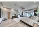 Spacious main bedroom featuring a fireplace, seating area, and access to a private balcony with pool views at 5438 Sierra Brook Ct, Las Vegas, NV 89149