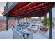 Charming outdoor space with cozy seating around a stone fire pit, perfect for enjoying evenings under the stars at 5438 Sierra Brook Ct, Las Vegas, NV 89149
