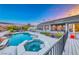 Gorgeous backyard featuring a sparkling pool and spa, ideal for relaxation and entertaining with lush landscaping at 5438 Sierra Brook Ct, Las Vegas, NV 89149