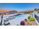 Serene backyard with a stunning pool, spa, and well-maintained landscaping perfect for outdoor enjoyment and leisure at 5438 Sierra Brook Ct, Las Vegas, NV 89149