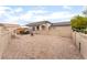 Wide backyard featuring decorative stone cover, a white fence and room for outdoor seating and relaxation at 5733 Dazzling Sparks St, North Las Vegas, NV 89031