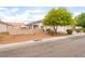 View of the house including the yard and vinyl fence for added privacy at 5733 Dazzling Sparks St, North Las Vegas, NV 89031
