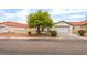 Well-maintained single Gathering home with a two-car garage and desert landscaping at 5733 Dazzling Sparks St, North Las Vegas, NV 89031