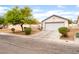 Charming single-story home with a two-car garage, a low-maintenance yard, and an inviting curb appeal at 5733 Dazzling Sparks St, North Las Vegas, NV 89031