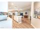 Contemporary kitchen island offers bar seating, flows into the living and dining spaces at 5733 Dazzling Sparks St, North Las Vegas, NV 89031