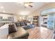 Spacious living area with vaulted ceiling, patio access, and view of kitchen and dining area at 5733 Dazzling Sparks St, North Las Vegas, NV 89031