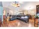Spacious open-plan living room with hardwood floors, recessed lighting, and a comfortable sectional sofa at 5733 Dazzling Sparks St, North Las Vegas, NV 89031