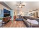 Living room featuring hardwood floors, comfortable seating, and an open layout to the kitchen at 5733 Dazzling Sparks St, North Las Vegas, NV 89031
