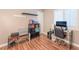 Home office with modern desk, dark shelving and hardwood-style floors at 5733 Dazzling Sparks St, North Las Vegas, NV 89031