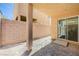 An empty covered patio area featuring concrete foundation and privacy wall at 6048 Aripeka St, Henderson, NV 89011