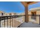 A balcony view showing neighboring houses under a clear sky at 6048 Aripeka St, Henderson, NV 89011