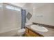 Clean bathroom with a shower-tub combination and modern fixtures at 6048 Aripeka St, Henderson, NV 89011