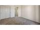 Neutral-toned bedroom with double closets, offering ample storage space at 6048 Aripeka St, Henderson, NV 89011