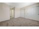 Bedroom with carpet flooring, sliding closet doors, and neutral walls at 6048 Aripeka St, Henderson, NV 89011