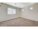Bedroom featuring a window and neutral walls with carpet flooring at 6048 Aripeka St, Henderson, NV 89011
