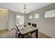 Bright dining room with backyard access and elegant lighting fixture at 6048 Aripeka St, Henderson, NV 89011