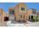 Charming two-story home with a balcony, attached garage, neutral stucco, and low-maintenance landscaping at 6048 Aripeka St, Henderson, NV 89011
