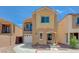 Charming two-story home with a balcony, attached garage, neutral stucco, and low-maintenance landscaping at 6048 Aripeka St, Henderson, NV 89011