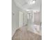 Upstairs hallway with carpet flooring with natural light and neutral walls at 6048 Aripeka St, Henderson, NV 89011