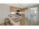 Open kitchen design with stainless steel appliances and convenient bar seating at 6048 Aripeka St, Henderson, NV 89011