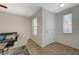 Inviting living room with neutral paint, a cozy couch, decorative pillows, and ample natural light at 6048 Aripeka St, Henderson, NV 89011