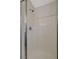 Shower with glass doors and white tile at 6048 Aripeka St, Henderson, NV 89011