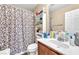 Cozy bathroom featuring a shower/tub combination and vanity with storage at 6068 Conroe Ct, Las Vegas, NV 89118