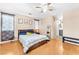Bedroom features hardwood floors, closet, and windows at 6068 Conroe Ct, Las Vegas, NV 89118