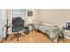 Bedroom featuring a desk, gaming chair, and comfortable bed at 6068 Conroe Ct, Las Vegas, NV 89118