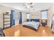 Bedroom featuring ceiling fan, hardwood floors, and a window at 6068 Conroe Ct, Las Vegas, NV 89118
