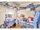 Walk-in closet with ample storage shelves filled with clothes and accessories at 6068 Conroe Ct, Las Vegas, NV 89118