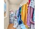 Bright walk-in closet with organized clothing racks and storage drawers at 6068 Conroe Ct, Las Vegas, NV 89118
