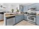 Well-equipped kitchen featuring stainless steel appliances, ample cabinet space, and functional layout at 6068 Conroe Ct, Las Vegas, NV 89118