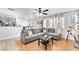 Bright living room featuring neutral tones, a ceiling fan, and an open layout, perfect for modern living at 6068 Conroe Ct, Las Vegas, NV 89118