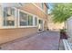 Inviting patio with neutral pavers, outdoor seating, and lush greenery at 6068 Conroe Ct, Las Vegas, NV 89118