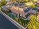 Aerial view of a private backyard oasis featuring a sparkling pool, mature landscaping, and solar panels at 6120 Kings Brook Ct, Las Vegas, NV 89149