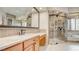 Bathroom featuring a glass shower, vanity, sleek fixtures, and ample counter space at 6120 Kings Brook Ct, Las Vegas, NV 89149